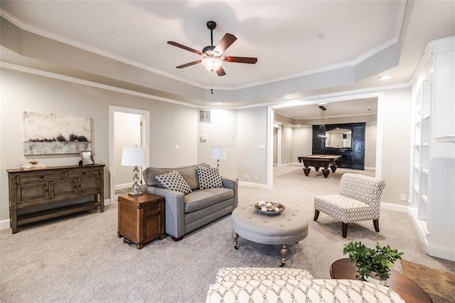 carpeted living room with crown molding, pool table, a tray ceiling, and ceiling fan