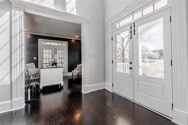 foyer featuring dark hardwood / wood-style flooring and french doors