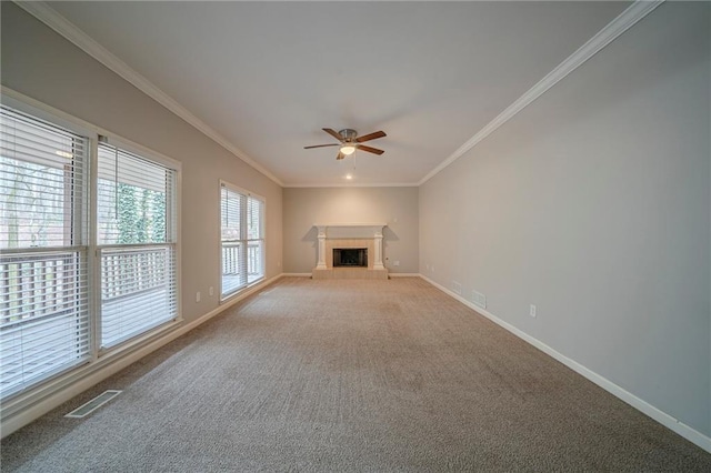 unfurnished living room featuring a ceiling fan, baseboards, visible vents, a tiled fireplace, and crown molding