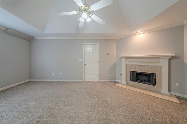 unfurnished living room featuring light carpet, baseboards, a tiled fireplace, and lofted ceiling