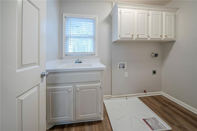 laundry area featuring hookup for a gas dryer, dark wood-style floors, hookup for an electric dryer, washer hookup, and a sink