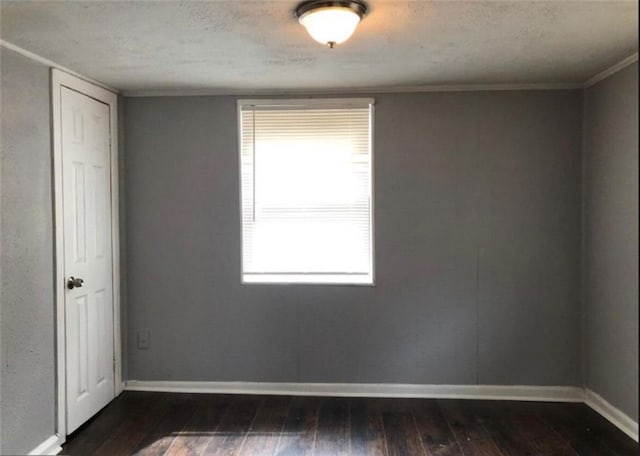 116 Lambert Dr, Stockbridge, GA 30281 - spare room featuring dark wood-style floors, baseboards, and a textured ceiling