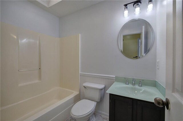 full bathroom featuring shower / bath combination, vanity, and toilet