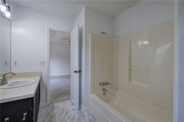 bathroom featuring shower / bathing tub combination and vanity