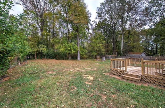 view of yard featuring a wooden deck