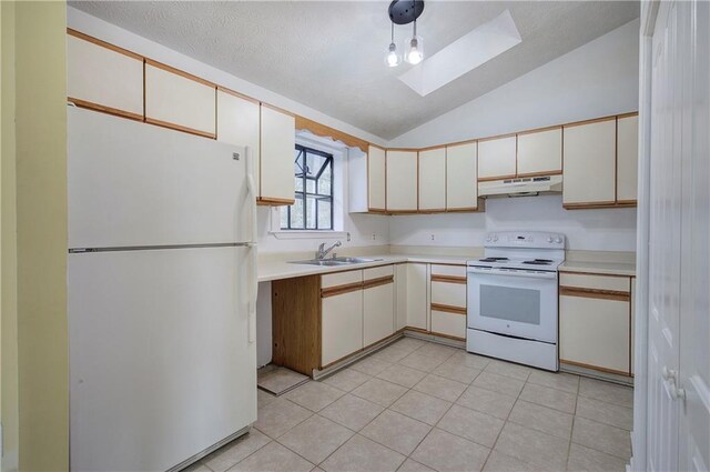 kitchen featuring sink, white appliances, light tile patterned floors, and lofted ceiling with skylight