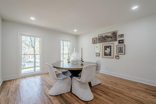 dining area with recessed lighting, baseboards, and wood finished floors