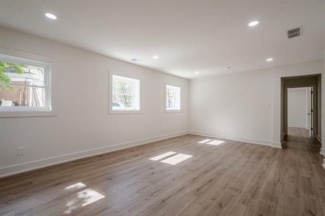 spare room with visible vents, baseboards, light wood-style flooring, and recessed lighting