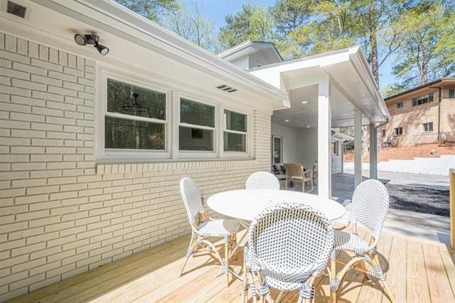 deck featuring outdoor dining space