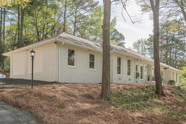view of property exterior featuring brick siding