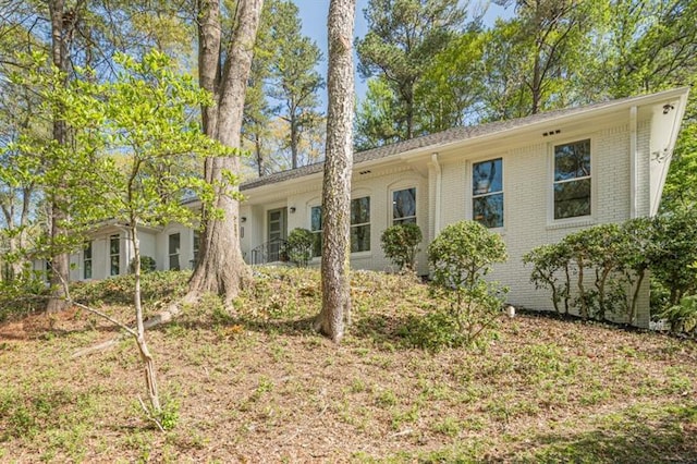 single story home with brick siding