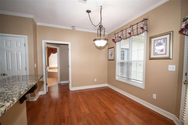 unfurnished dining area with wood-type flooring and ornamental molding