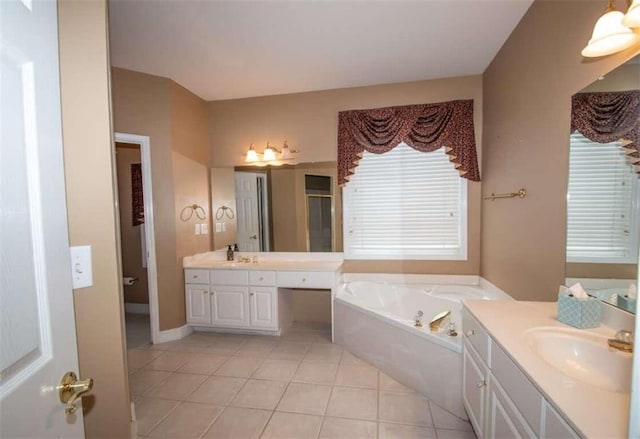 bathroom featuring plus walk in shower, tile patterned flooring, and vanity