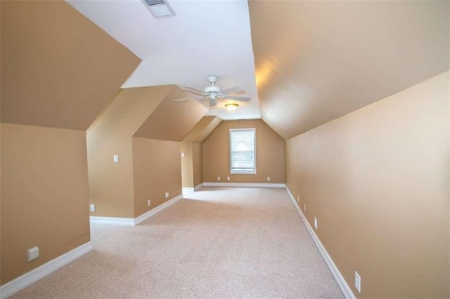 bonus room featuring ceiling fan, light colored carpet, and lofted ceiling