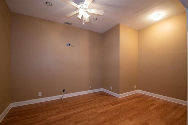 unfurnished room with hardwood / wood-style flooring and ceiling fan