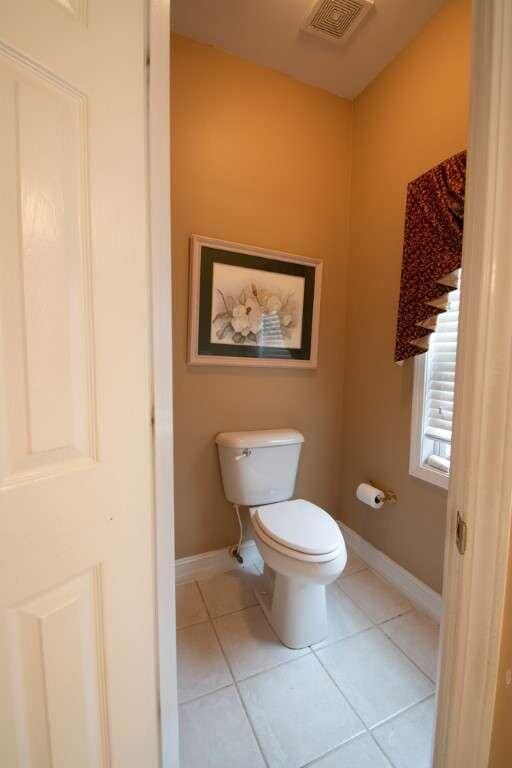 bathroom featuring tile patterned floors and toilet