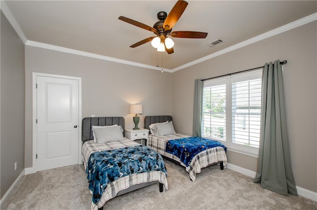 carpeted bedroom with a ceiling fan, baseboards, visible vents, and ornamental molding