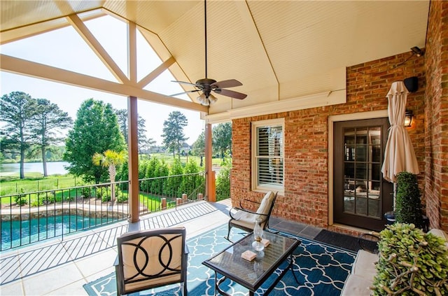 view of patio with a fenced in pool, a ceiling fan, fence, and an outdoor living space