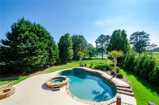 view of swimming pool with a pool with connected hot tub and a patio area