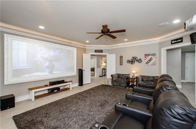 home theater with baseboards, a ceiling fan, recessed lighting, and wood finished floors