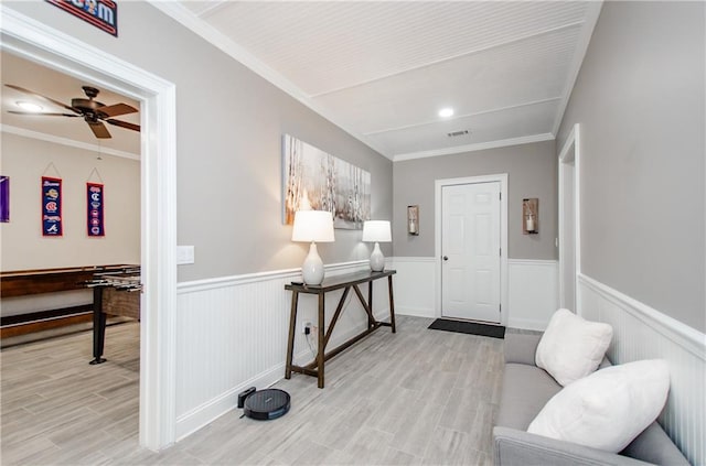 entryway with visible vents, a wainscoted wall, and light wood-style floors