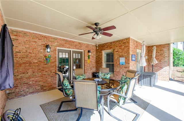 view of patio featuring a ceiling fan and outdoor dining area