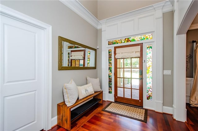entryway with baseboards and wood finished floors