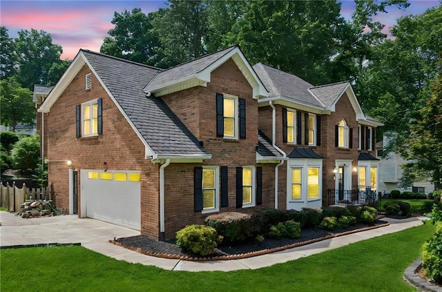 742 Maggie Ct NW, Kennesaw, GA 30144 - view of front of house with an attached garage, concrete driveway, brick siding, and roof with shingles