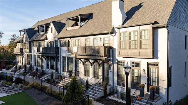 rear view of house with a balcony