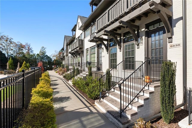 view of side of home with a balcony