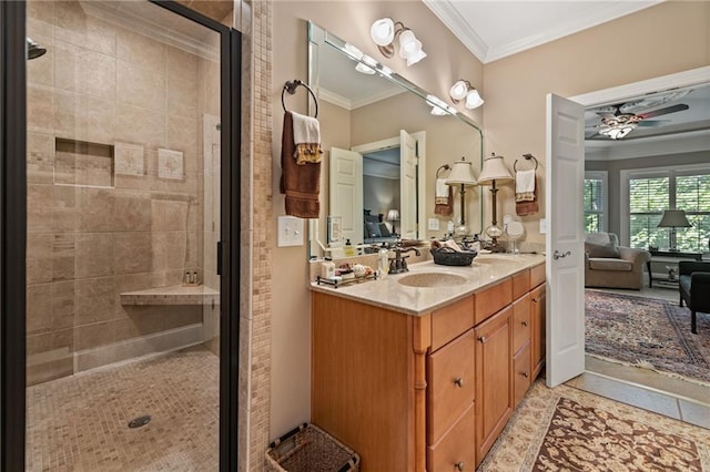 bathroom with walk in shower, ornamental molding, vanity, and ceiling fan