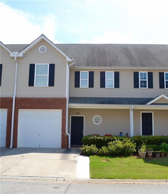 view of front facade featuring a garage and a front yard