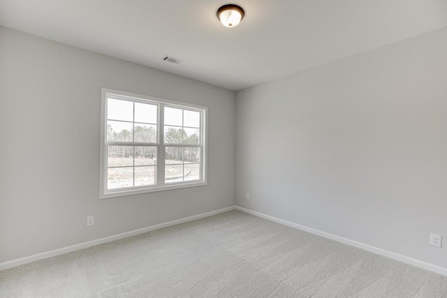 unfurnished room featuring carpet flooring