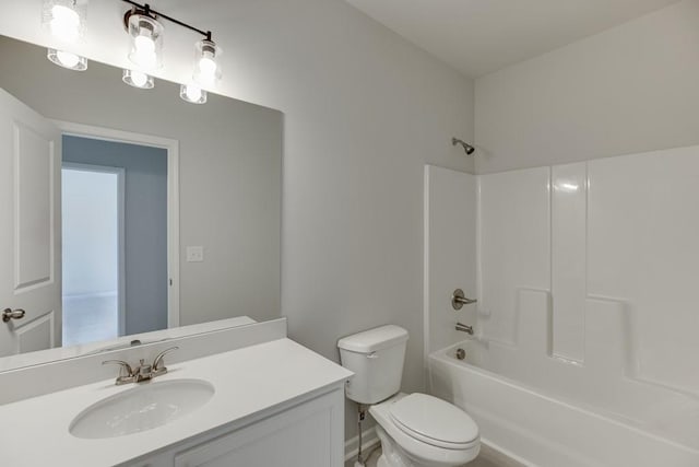 full bathroom featuring shower / bathing tub combination, vanity, and toilet