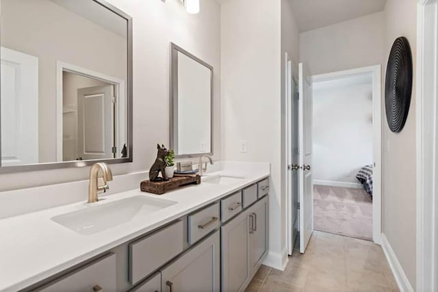 102 Sheryl Way, Loganville, GA 30052 - full bathroom with double vanity, ensuite bathroom, baseboards, and tile patterned floors