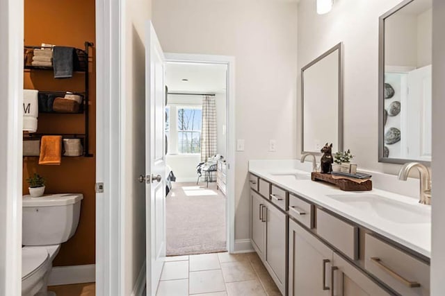 102 Sheryl Way, Loganville, GA 30052 - full bathroom featuring double vanity, toilet, baseboards, and tile patterned flooring