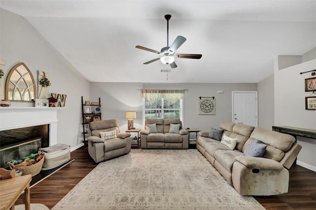 1050 Birdseye Vw, Locust Grove, GA 30248 - living room with lofted ceiling, wood finished floors, a ceiling fan, and a fireplace