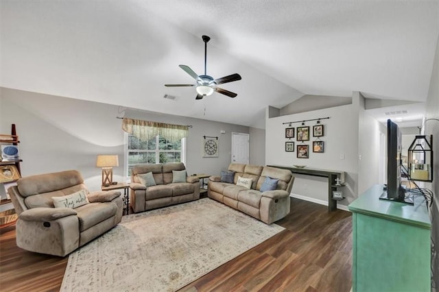 1050 Birdseye Vw, Locust Grove, GA 30248 - living room featuring vaulted ceiling, dark wood-style floors, and ceiling fan