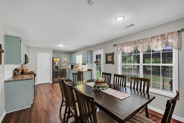 1050 Birdseye Vw, Locust Grove, GA 30248 - dining room featuring a textured ceiling, dark wood-style flooring, and recessed lighting