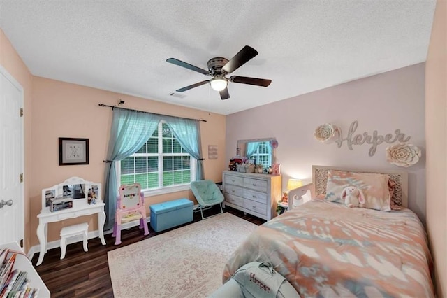 1050 Birdseye Vw, Locust Grove, GA 30248 - bedroom featuring wood finished floors, a textured ceiling, and ceiling fan