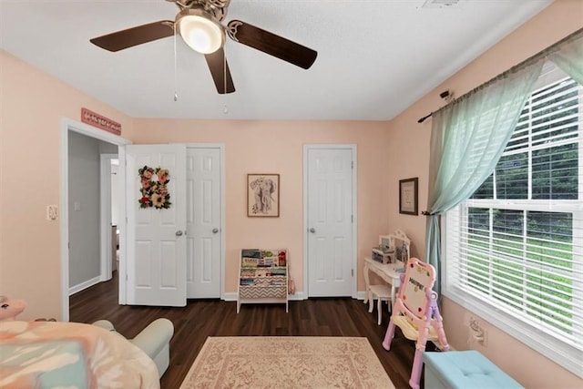 1050 Birdseye Vw, Locust Grove, GA 30248 - bedroom featuring dark wood-style floors and ceiling fan