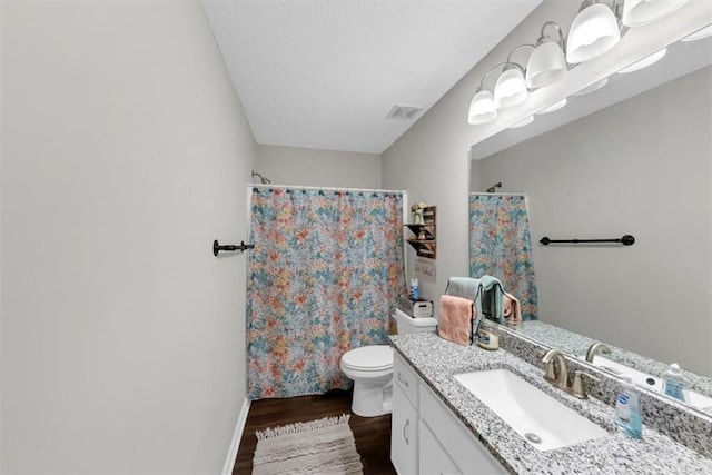 1050 Birdseye Vw, Locust Grove, GA 30248 - full bath featuring wood finished floors, vanity, a shower with curtain, and a textured ceiling
