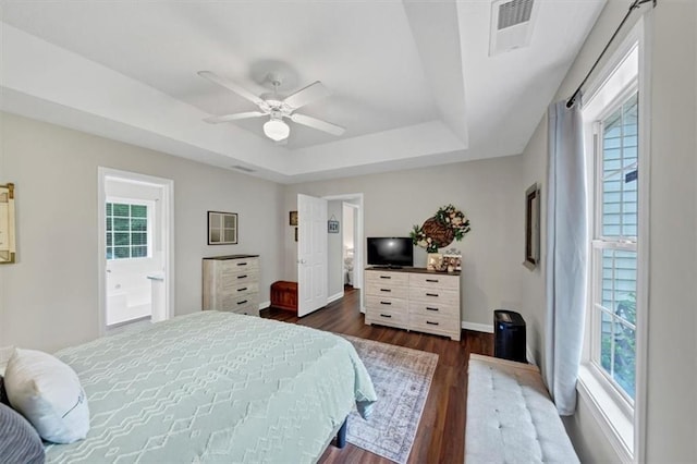 1050 Birdseye Vw, Locust Grove, GA 30248 - bedroom with a tray ceiling, dark wood-type flooring, a ceiling fan, and ensuite bathroom