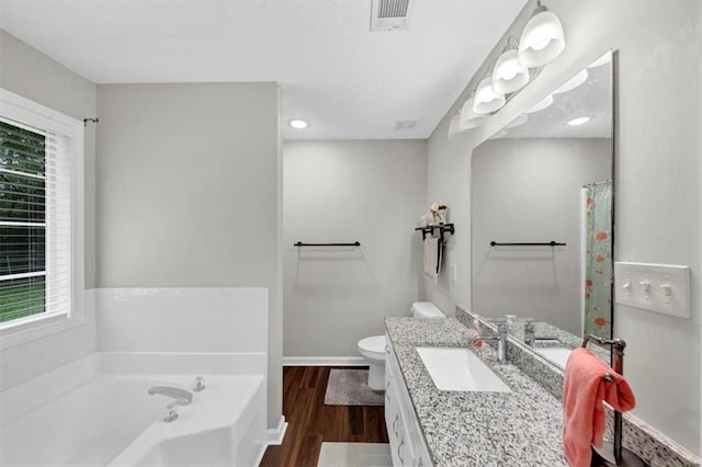 1050 Birdseye Vw, Locust Grove, GA 30248 - bathroom with vanity, a bath, wood finished floors, and recessed lighting