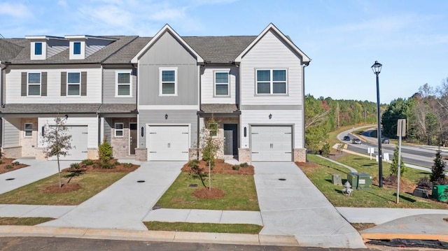 view of property with a front yard and a garage