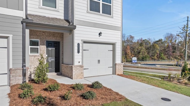 view of exterior entry featuring a garage