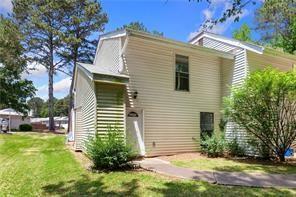 4406 Idlewood Ln, Tucker, GA 30084 - rear view of property with a lawn
