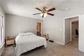 4406 Idlewood Ln, Tucker, GA 30084 - carpeted bedroom featuring baseboards and ceiling fan