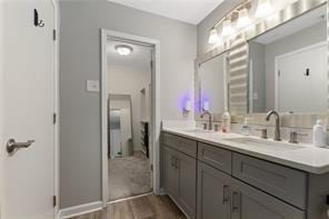 4406 Idlewood Ln, Tucker, GA 30084 - full bath with wood finished floors and double vanity