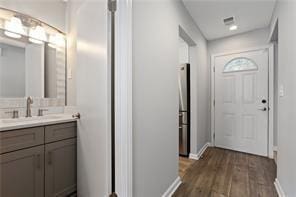 4406 Idlewood Ln, Tucker, GA 30084 - entryway with baseboards and dark wood finished floors